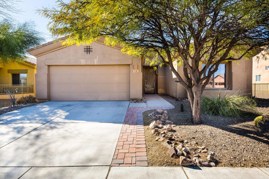 Move in ready single story, extended 2 car garage home with upgraded tile flooring, fresh paint, and landscaped backyard. Home entrance features a beautiful wrought iron security door that leads to an open family room and kitchen layout. Windows have newly added blinds that allow for natural light to fill dining and living area. Kitchen has a deep pantry and breakfast bar. Split floor plan with two full bathrooms and three bedrooms. Master Suite is spacious with walk in closet and long bathroom vanity. Backyard features artificial grass and full patio deck with pavers extension for larger sitting area to enjoy the desert sunsets. No rear neighbors. Neighborhood includes community pool with hot tub and grill area. Park has new playground equipment. Within walking distance to shopping area.