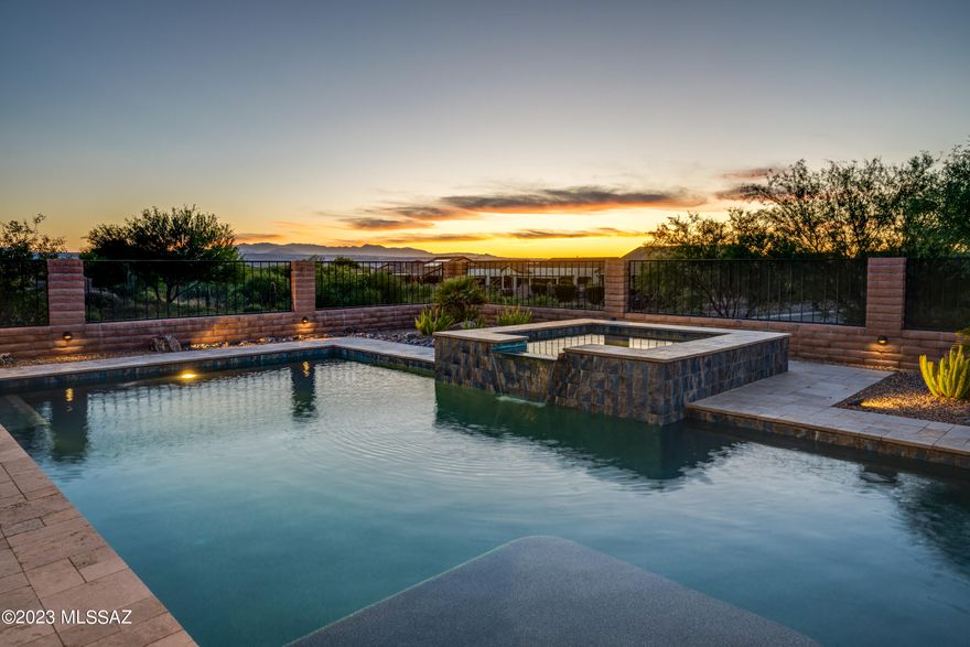 Spectacular sunset views, private corner lot backing to arroyo, and refreshing pebble sheen pool/spa highlight this like new 2019 Tesoro model in Quail Creek resort community. Why build? This well appointed home is ready now! Gorgeous kitchen w/ knotty alder cabinets, island, quartz counters, tile backsplash, SS appliances, 36'' gas cooktop, convection oven, 41'' uppers w/ crown, pot drawers, pull-out shelves, butler's pantry, UC lighting. Spacious Great Room  w/ exposed beams, wet bar. Ext. Owner's Suite w/ 2 walk-in closets w/ organizers, bath w/ Curbless shower. 3' Expanded Den. Guest BR w/ en suite bath. Powder room. Plantation shutters. All tile floors. Laundry w/ sink. Cabinets galore! Covered patio overlooks stunning, heated salt water pool. Garage w/ epoxy floors, golf cart bay.