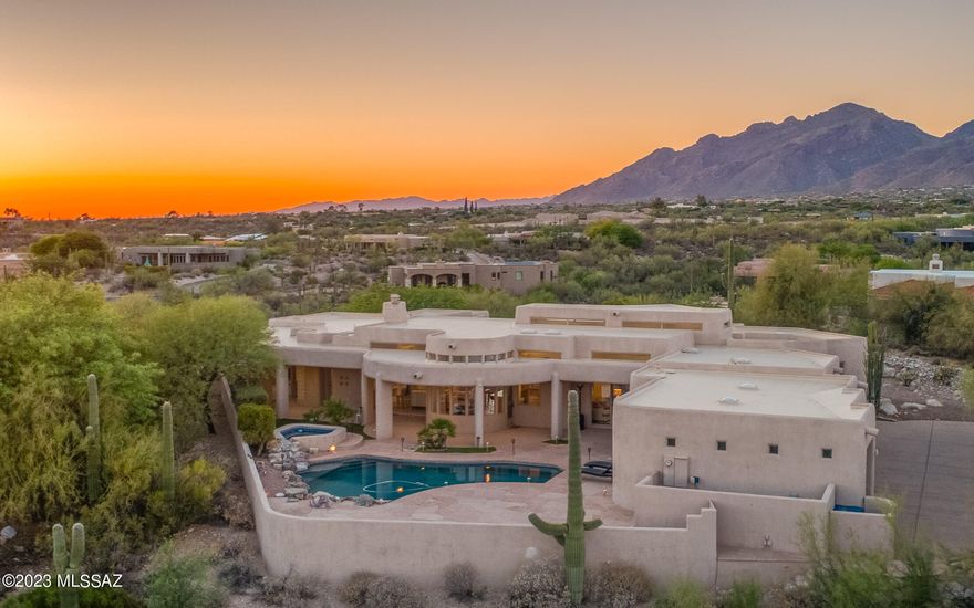 Hacienda Del Sol Estates Finest! Step into pure luxury with spectacular location, pristine views & a stylish contemporary vibe! This estate sits atop a pristine view lot with stunning city and mountain views galore. Inside you are warmly welcomed with soaring ceilings, sparkling natural light & a feeling of peace. The kitchen is gourmet grade and opens to the family room & backyard. There is tons of room to entertain with deep covered patios and infinity views overlooking the city below! The primary suite is a true retreat with spa like bathroom, expansive walk-in closet & bonus office attached looking at the magnificence of the Santa Catalina mountains. The split floorplan allows for privacy & comfort for all! Guard gated & perfectly located, this estate feels a world away!