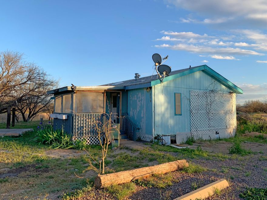 Farm county north of Benson/ I-10! 1997 Fleetwood doublewide. All paved roads. The residence is simple, homespun and, after ''elbow grease'' it will serve as a fine home. The land is flat, has mesquite trees and native grasses. All of it is in Zone A FEMA flood plain. The home is situated near the center point of its acreage. Easy access to I-10 and to all the stores in Benson including Walmart and Safeway! Pomerene Water district is the water company. The property is sold as-is.