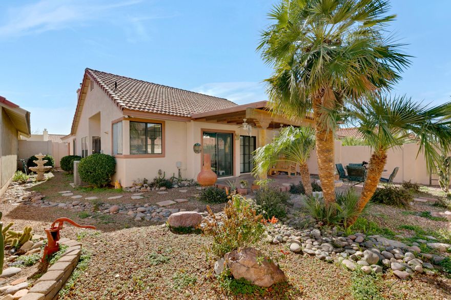 Lots of natural light, tall ceilings, beehive fireplace, & spacious living ares.  AC/heat pump 2016 & kitchen appliances were new in 2016. Landscaped back yard with a Ramada & 2 fountains. One in the back & one on the side.  Back yard wall was  stuccoed & painted providing a nice back drop to the landscaping. All bedrooms, bathrooms & kitchen were freshly painted. New faucets & shower head in hall bath. New Kitchen sink & faucet.   Instant hot water was installed.  Mountain views from back & front yards.  Community offers a pool, spa, a&HOA covers trash, front yard landscaping, and maintenance to common areas.  Owner  has made many improvements she she purchased it. No Poly Pipes.