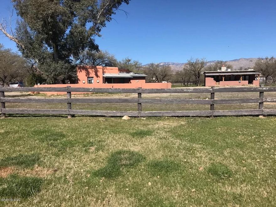 Tanque Verde Valley horse property and 2 casitas on secluded mesquite covered lot in Powder Horn subdivision. Original 1 BR/BA mud adobe casita dates to 1947 and was part of the Westinghouse ranch headquarters. Covered porches look out onto the irrigated horse pastures which surround the property on all sides. Private well serves both casitas. Zoning may permit custom home in addition to the existing casitas. Located in the gated community of Powder Horn, but property is not subject to CCR's or annual HOA dues.