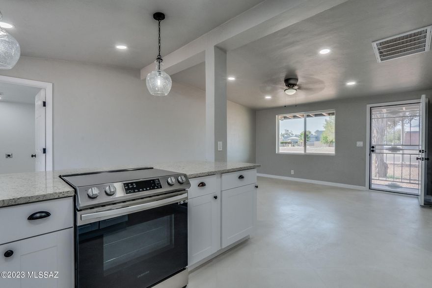 Welcome to this beautifully remodeled 1951 home, where classic charm meets modern luxury. Situated on a generous .23-acre lot, this property offers ample space for outdoor activities and gardening while being conveniently located in a convenient central neighborhood.

As you step inside, you'll be greeted by the perfect blend of old-world charm and contemporary design. The kitchen has undergone a stunning transformation, boasting exquisite granite countertops that add a touch of elegance and functionality. The sleek cabinetry and stainless-steel appliances create a seamless, sophisticated look that any chef would love.

One of the standout features of this home is the polished concrete flooring throughout the main living areas. This trendy and durable flooring choice not only (more) enhances the overall aesthetics of the space but also provides a low-maintenance, easy-to-clean surface.

To keep you comfortable all year round, a brand new air conditioning system has been installed, ensuring a cool and refreshing atmosphere during hot summer days and cozy warmth in the colder months.

Natural light floods the interior through newly replaced windows, providing an inviting ambiance that complements the neutral color palette and highlights the beauty of the interior finishes.

The expansive .23-acre lot offers boundless possibilities for outdoor enjoyment. Whether you envision hosting lively gatherings, cultivating a lush garden, or creating your own private oasis, there is ample space to turn your dreams into reality. Also, includes grey water laundry.

This remodeled 1951 home is a delightful blend of vintage charm and contemporary amenities, making it a perfect choice for those seeking a harmonious living experience. With its modern upgrades and expansive lot, this property is a rare gem that offers both comfort and convenience in a timeless setting.