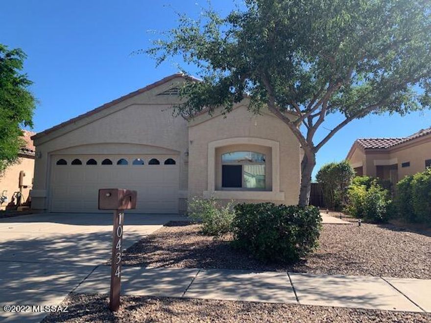 Located in beautiful Mesquite Ranch nestled conveniently between Rita Ranch and East Tucson with community pool and park! Vail School District! New roof and new A/C , ceiling fans throughout! Beautiful 3 bdrm, 2 bath home, with extra large great room wired for surround sound speakers,  kitchen has newer appliances, lots of storage, large pantry, breakfast bar, Master bdrm has his and her closets, large bathroom w/ double vanity, and soaking tub, large secondary bdrm with built in shelving and walk in closet, laundry room,  desert and mountain views from back covered patio, grass yard for kids to play and an extended brick patio for entertaining, shelving for storage in garage. Convenient to Raytheon, DMAFB, Amazon and Target fulfillment centers, easy access to I10