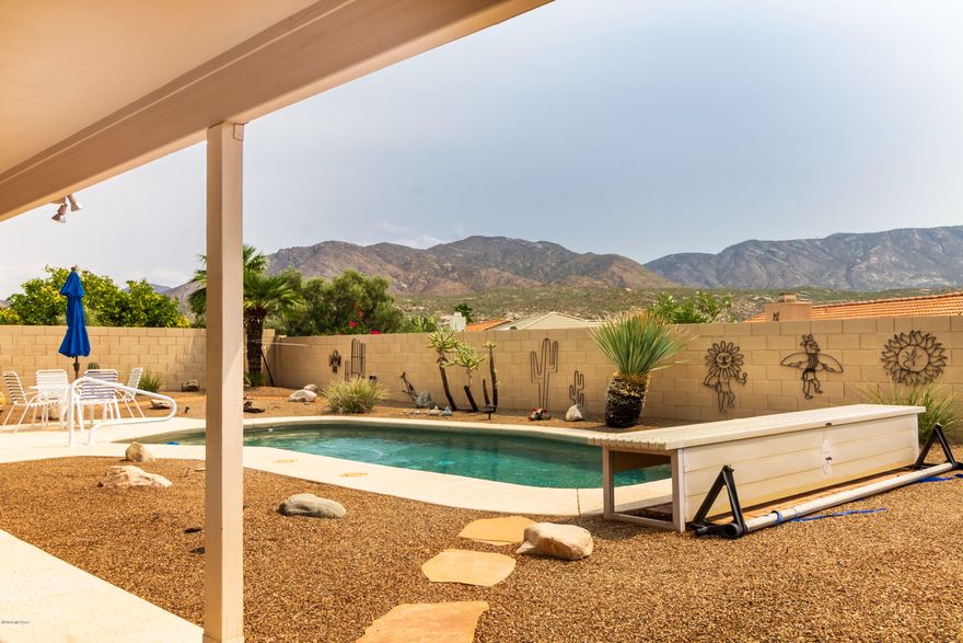 Wonderful Sonora Model with Great East Mountain Views, Pool & Covered Patio which Extends the Full Length of the House in Backyard in SaddleBrooke, Tucson's #1 Active Adult Com. Great Room with Gas Fireplace, Plantation Shutters & Sliding Glass Doors to Extended Patio & Built-in BBQ with Fridge. Kitchen w/Engineered Stone Counters and SS Appliances & Window over Sink Looks Out to Fantastic Mountain Views. Dining Area with Bay Windows also Enjoys Mountain Views as well as Spacious Master Bedroom with Sliding Glass Doors to Patio & Pool has In-Suite Bath with Shower & Double Vanities. Low care Desert Plantings in Backyard as well as Pebble Tec Pool Heated with Solar, Owned by Seller. Garage Extended 4 ft. has Storage Cabinets on Both Sides. Lot has Plenty of Room to Build Guest House.