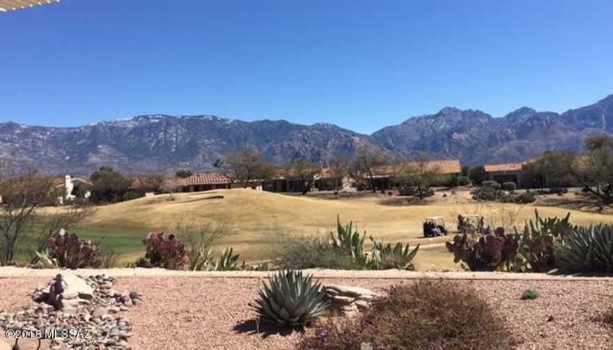 Pacifica Plan on one of the BEST VIEW LOTS in Sun City! Overlooks golf course below w/unobstructed Catalina Mountain Views! Very private at end of cul-de-sac with open green belt on one side. Great floor plan with Kitchen opening to Family Room on the view-side of the house. Family Room opens to a spacious covered brick patio facing the mountains.Split bedroom plan, Master with Bay Window & large Master Bath w/walk-in closet, Garden Tub and Separate Shower.Kitchen has granite counter & stainless steel. Extra Room off Kitchen is nice office.Golf Cart Garage plus lots of built in cabinets. Newer roof, well maintained home. A Gem!!