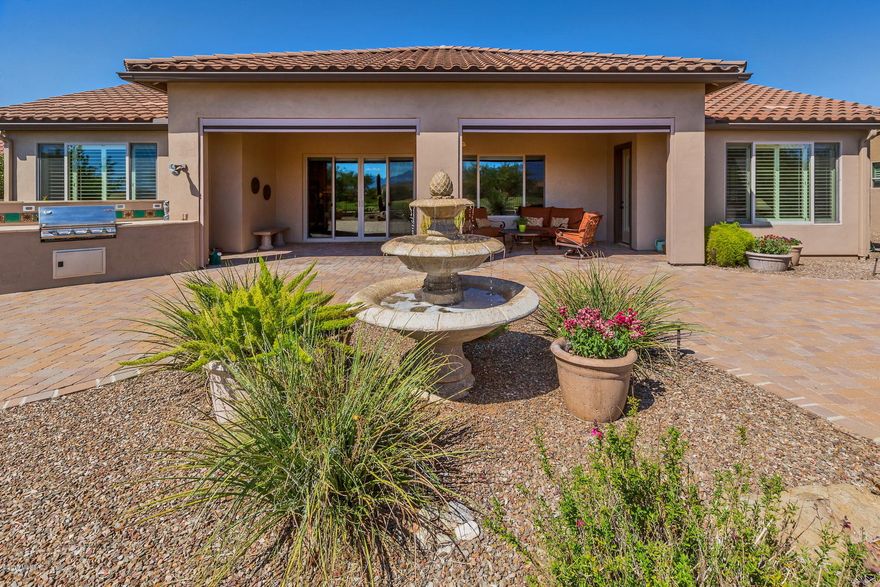 Unbeatable Panoramic Views await with this beautiful Brisa Model looking to the mountains over the 11th golf course green. Why wait when you can be enjoying the view from the expansive rear patio with outdoor grill, or relaxing by the fireside watching your favorite show on the elegant entertainment center? Premium amenities abound*Casita with full bath, Wolf Gas Cooktop, GE Monogram Double Ovens, Microwave, & Warming Oven, Granite Countertops, Gas Log Fireplace, Curbless shower in Master bath, Fountains in front courtyard & back patio, Ceiling Fans, Plantation Shutters throughout, Sub-Zero Wine Cabinet in Laundry Room. Amenities at this active adult community include fitness center, indoor pool, resort style outdoor pool, tennis & pickleball courts, 18 hole golf course, and so much more!
