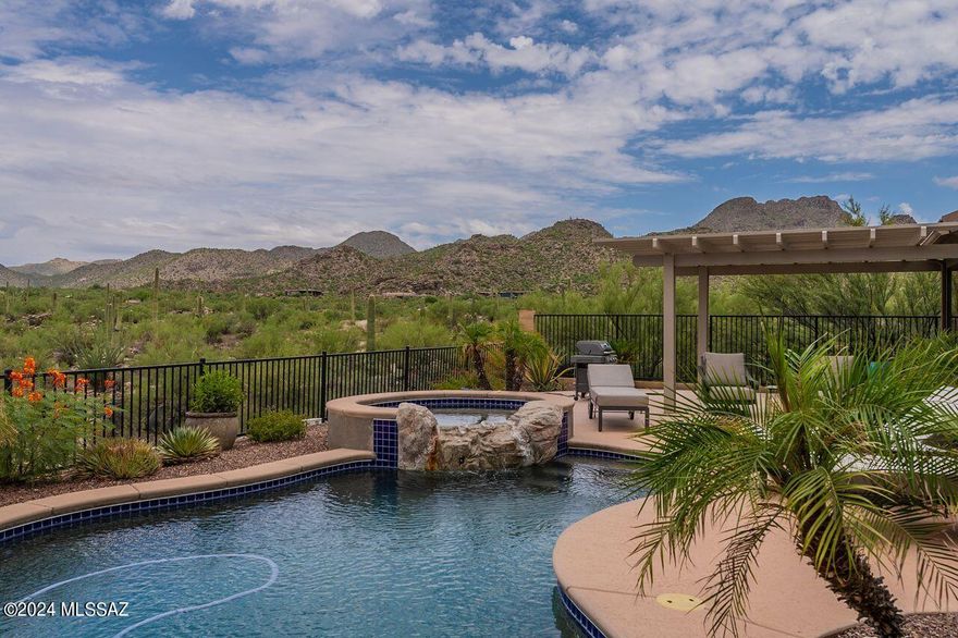 GORGOUSLY REMODELED Tortolita Mountain & desert views, this home is tucked away at the end of a cul de sac w/ giant boulders & access to hiking trail!  Gated courtyard w/ pergola welcomes you. Open great room w/ FP, huge island, neutral countertops & backsplash, family dining, all overlooking stunning views. Plus formal DR!  Spacious owners suite features patio access, large shower & soaking tub w/ beautiful tile, custom closet. Nearby is laundry w/sink, cabs & garage access. Office has built ins & beautifully carved barn doors. BR 2 has en suite. BR 3 has access to hall bath. The PERFECT rear yard offers: pool, spa, waterfall, covered patio plus pergola covered area w/ all encompassing VIEWS! Soft water loop & many upgrades! Call for private showing !