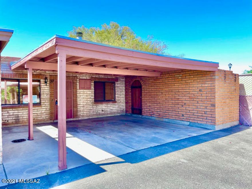 Check out this cute 2br/1ba townhome in central Tucson! This is an end unit that boasts granite tile counters and eat-in kitchen, fireplace in the great room, 2-car carport and relaxing, easy-to-maintain & private yard with storage shed, and a waterfall pond for ambiance. The Northgate Townhomes community is quiet & friendly, with a gated pool for residents. Stores and other conveniences are within walking distance.