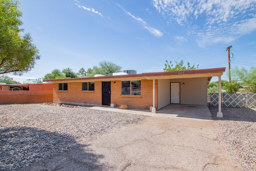 Charming slump block home. This 3 bdrm 2 bth-boast all the modern touches, a family room and a living room, Open Kitchen with a large pantry, Stainless steel appliances, new flooring, all new lights and fixtures throughout. Tile surrounds to the ceiling in both bathrooms, master suite with a generous closet.  Spacious back yard. Located close to shopping, restaurants. This home is ready for you.