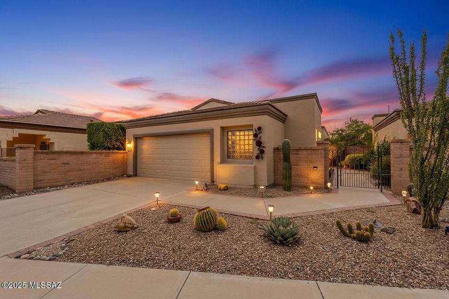 With clean lines and contemporary style, this lovely home captures the essence of modern Southwestern elegance while embracing the laid-back outdoor lifestyle that makes Arizona living so irresistible! 
Both the kitchen and the living areas are open to the back yard patio, creating the perfect indoor-outdoor connection for daily living and entertaining. The kitchen offers plenty of space for a computer desk or office area and glows with sparkling quartz counters and maple cabinetry. A breakfast nook is perfect for simple meals and a separate dining area hosts more formal events. Sliders in both rooms look out onto the inviting backyard.  The living room is spacious and comfortable.  Natural light pours through every window, illuminating the bright, airy interiors that feel fresh and uncluttered.  The covered back patio area
provides shade while dining al fresco with friends, and the paved area beyond encourages guests to gather around the fire pit for conversation and star gazing.  Beautifully landscaped, this outdoor space will be the center of your memories for years to come.  A guest ensuite provides privacy and comfort for you guests, or can double as a private office or media room.
This home celebrates the unhurried pace and natural beauty that defines authentic Southern Arizona living. Your new lifestyle awaits, one where ease of living and outdoor time isn't just possible, it's inevitable.