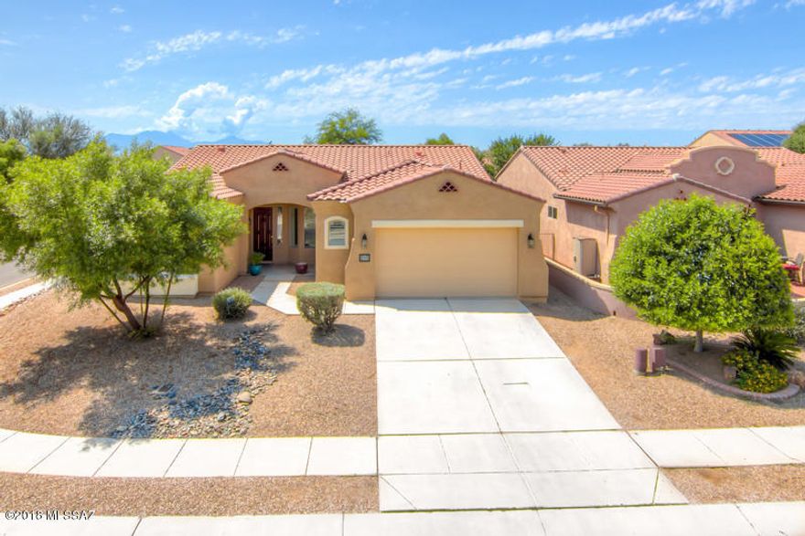***MOVE IN READY***Beautiful Large Single Story Home on a corner lot in the desirable Presidio Del Valle Neighborhood in Rancho Sahuarita,This 3 Bedroom 2 Bath with 2,142 SQFT 2 Car Garage Home with a formal dining room,Home offers plantation shutters throughout,Family room has laminated beautiful flooring,Property is on a large corner lot just a short walk to all the great amenities Rancho Sahuarita has to offer. You will enjoy this great open floor-plan with lots of natural light,Backyard has an extended porch for those amazing family gatherings, Large master suite with large bathroom & Closet,Don't Miss this opportunity it will not last long, Call to schedule a private tour of the home today.
