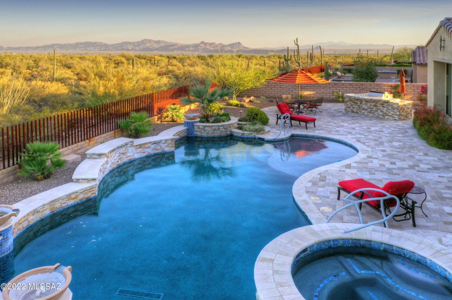 AMAZING TOLL BROS ESTATE NESTLED IN LOS SAGUAROS@ DOVE MTN! ''HARD TO FIND''- PREM EAST FACING- INCREDIBLE VIEWS OF  MAJESTIC CATALINAS, GALLERY GOLF COURSE & BRILLANT CITY LIGHTS! ORIGINAL OWNERS- FILLED THIS HM W/UPGRADES! ENTER DRAMATIC COURTYD, HUGE GATHERING ROOM, 12 FT CEILINGS, STACKED STONE MEDIA WALL- SOUND SYSTEM/TV, LINEAR FP, BUILT IN BOOKCASES & VANISHING WRAP AROUND DOORS- LEAD TO OUTDOOR LIVING SPACES! ELEGANT STUDY- FLR TO CEILING WOOD BOOKCASES/DESK! CHEF'S DREAM KIT- HUGE WORK ISLAND, GRANITE CTRS, SS APPLIC- INCLS SUBZERO REFRI, ALDER CABS- OPENS TO CASUAL DINING W/VIEWS OF SOMBREO PEAK! RESORT BKYD- HEATED POOL/SPA, ALFRESCO KIT/BBQ, TRAVERTINE PAVERS, BORDERS GOLF COURSE, MTN VIEWS GALORE!
2 PRIMARY SUITES- BOTH W/SPA BATHS, ALL EN-SUITES! FURNISHINGS FOR SALE- TURN K