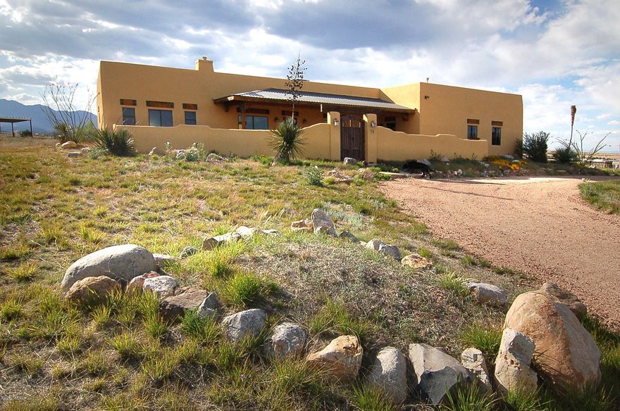 Impeccable Santa Fe Contemporary in walking-biking-riding distance of Sonoita's Crossroads hub of activity, restaurants & Fairground fun; a short drive to premier local wineries & hill country festivities! Of demonstrable quality & style, this Master-built home is very easy to appreciate & will be life enriching with its devotion to quality, details, finishes & comforts. A gracious 2,477 split-plan w/3Be/3Ba/Den/GrtRm + FamRm/2G, in an ULTRA-convenient 1.75 acre setting. Features include fully appointed Chef's Kitchen (opening onto the separate Family Room); lux Master Suite w/his-hers walk-in closets; Den w/BdRm-Studio potential; scored concrete floors, soaring ceilings, o/s windows & designer details t/o. Walled garden courtyard & mtn views. Owner is an AZ licensed Real Estate Broker.