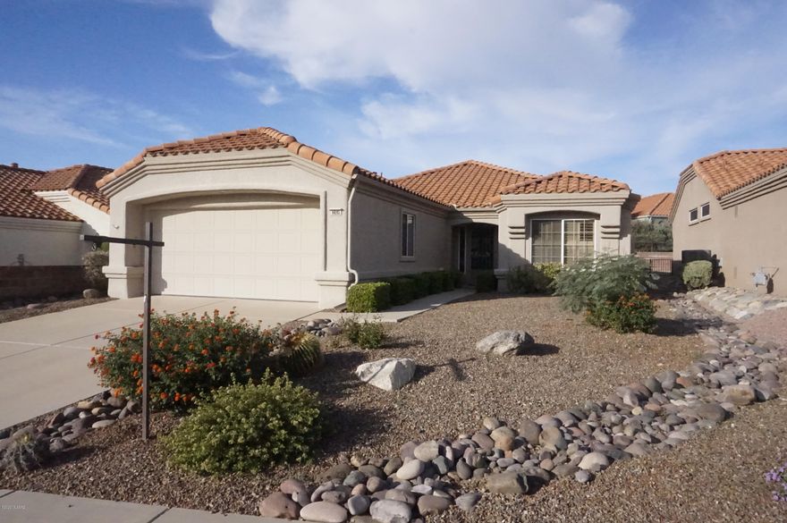 Stunning Remodel of an Expanded Mariposa Plan. Private Walled Yard w/Aluminum Ramada, Low Brick Walled Patio, Doors from Dining Area & Office. Custom Kitchen w/Cherry Finished Cabinets, Slab Granite Counters, Undermount Sink, Breakfast Bar w/Pendant Lighting, Stainless Appliances. Tiled Floors all but 2 BR's, Laminate Flooring in Office w/Built-in Desk Wall. Custom Master Bath w/Executive Height Sink, Tiled Walk-in Snail Shower, Spacious Master Closet; Master Bedroom open to Office/Den Addition. Hall Bath w/Custom Tiled Shower, Glass Door, Solid Surface Counter. Plantation Shutters in LR, BR2, Dining Area. Living Rm w/TV Niche, Granite Service Counter open to Kitchen. BR2 w/dbl closet. Ceiling fans thruout. Newer HVAC, Newer Roof. 2 Car Garage w/Cabinets, Laundry Hookups, Sink. Don't Miss!