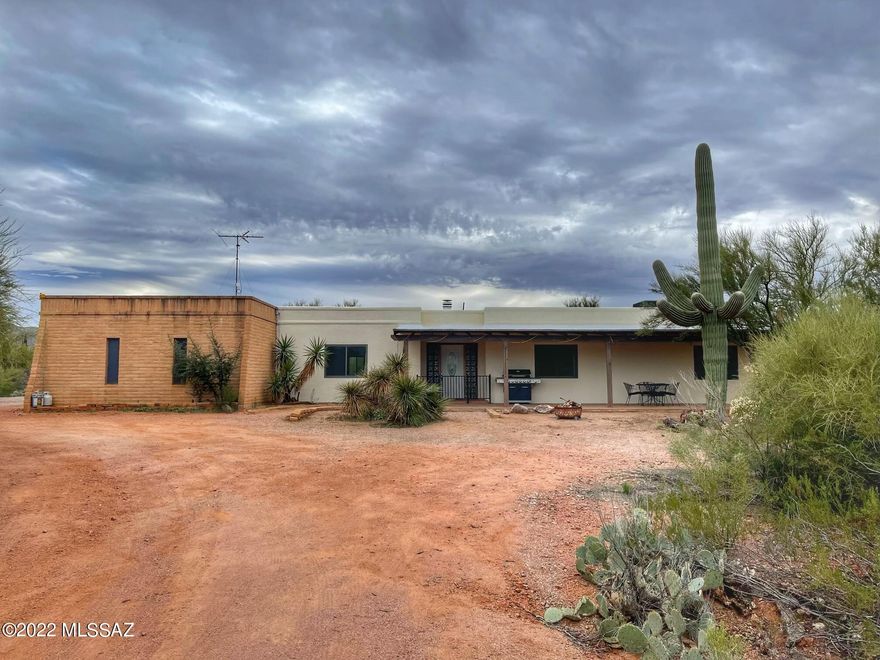 Seller will accept/entertain offers between $600K-650K. Welcome home to your peaceful and private, desert escape! As you make your way to this 4.4+ acre horse property, you'll be greeted with breathtaking panoramic mountain views. This 4 bedroom, 3 full bath home offers a split floor plan with dual masters, Saltillo tile throughout, updated bathrooms, and kitchen with SS appliances, and expanded storage. Additional features also include a large Arizona room, partially enclosed back patio, 4 horse stalls and tack room. Property is being sold ''as-is'' and has some minor deferred maintenance but with a little TLC this is a fantastic opportunity to own a slice of Arizona living!