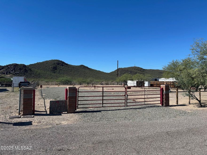 Prime,.37 acre. MANUFACTURED HOME LOT backing up to Los Monteros Conservation Area with stunning mountain views! This spacious lot offers privacy, convenience, and breathtaking scenery. All utilities are available, and property is fully fenced ready for your manufactured or site built home. Enjoy unobstructed panoramic views of the mountains to the west overlooking the serene Los Monteros Conservation Area while the Catalina Mountains rise dramatically to the east across a wide open, vacant area.  No HOA fees a plus! Located in a quiet, private neighborhood just minutes from shopping, dining, and easy access to I-10, this lot combines the best of natural beauty and urban convenience.