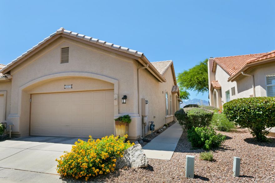 This Riviera villa shows like a new home, located in SaddleBrooke, Tucson's Premier Active Adult Retirement Community. New roof, new hickory cabinets, updated bathrooms, murphy bed and desk in the guest bedroom, new stainless steel appliances, new HVAC in 2016, flagstone patio, and fabulous mountain views from a south-facing patio.  This is walking distance to the clubhouse, pools and athletic facilities.
