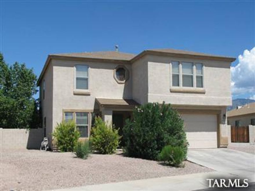Mountain views from this oversized rear yard which backs to the wash for added privacy. House features large backyard with sparking pool. Master suite is adorned with garden tub and large closet. Front living/dinning room with additional family room off kitchen. Large loft upstairs is perfect for game, rec room or library. Kitchen features an island with lots of counter space and breakfast nook. Call today!