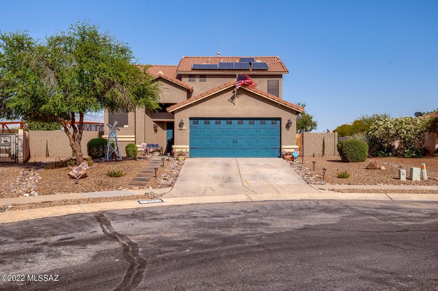 This updated Continental Ranch home with one of the largest lots in the subdivision welcomes you with an expansive open concept floor plan. Large windows in the cozy living area let the natural light spill in. Granite tile countertops, beautiful custom stone work on wall, custom light fixtures, and stainless steel appliances make this kitchen a dream for any home chef. The second level boasts a master suite with private balcony, double vanity, jetted tub, and walk-in closest. Large backyard with views of the Catalina Mountains, grass, covered patio, paved seating area with room for a pool, will make you feel at home. Close to I-10, restaurants, movie theater, shopping and so much more.  Don't let this turn-key home pass you by!