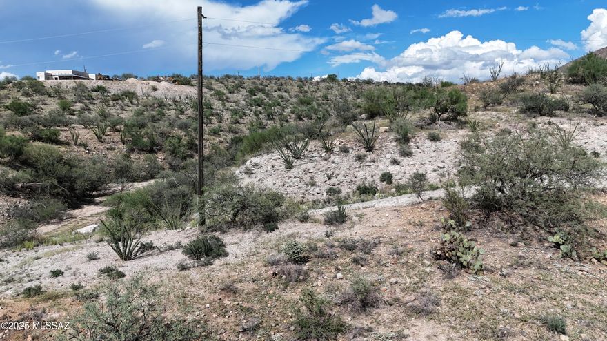 Triangle shaped lot with a wash that runs along the Northern boundary.  Great up close mountain views.