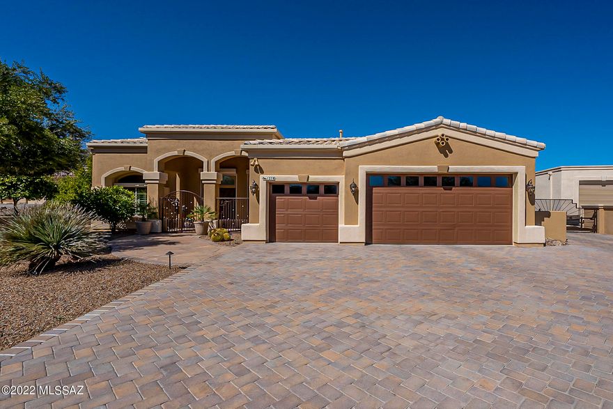 RESORT LIVING AT HOME!!  Exceptional home w/triple & RV gar.  Vaulted ceilings.  Split floorplan.  20'' ceramic tile throughout except carpeted bedrooms & den.  Rear patio refuge w/solar & gas heated conv pool & spa, outdoor kitchen, gazebo, covered porch, cool decking, flagstone, artificial turf, shrubs, mature landscaping  & deco gravel.  Plantation & outdoor rolling shutters throughout.  Gourmet kitchen features maple cabinets w/self closing drawers, granite counters, gas cooktop, bank of drawers, warming drawer, breakfast bar & nook, split-faced travertine back splash & gracious formal dining room.    Permanent 10kw Generac gas.  Laundry room w/full-sized stack washer & dryer.   Man cave RV garage to end all!