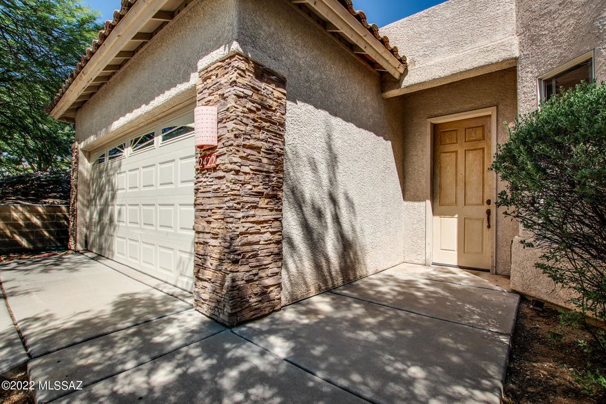 Welcome to this gated community in Northwest Tucson! Step into a great room with windows providing plenty of natural light. Immediately to your right you will find the kitchen which has plenty of storage and counter space. This 3 bedroom, 2 bathroom home provides plenty of livable space with 2,040 square feet. The only place you will find carpet in this home is in the master walk-in closet. Master bathroom provides you with double-vanity, a walk-in closet, tub and a walk-in shower. Step outside and see this high private lot that provides beautiful mountain views! Come take a look at this home today!