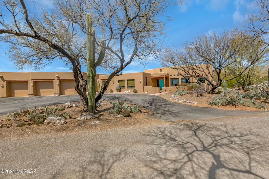Magnificent 4 BR hacienda has been updated with no expense spared . Situated on just over an  acre, nestled by mesquite tree ,panoramic desert landscape, wildlife and majestic mountain views. This home is filled with charm and elegance  featuring: soaring ceilings, energy efficient triple pane windows throughout, gracious room sizes and natural light abounds. New gourmet kitchen boasts SS appliances with double oven, farm sink and granite counter top and decorative backsplash.. Abundant solid antique white with glaze cabinetry with custom shelving. Delightful backyard with sweeping covered patio, hot tub and fire pit. Plenty of room to roam so bring toy's and RV because there are 4 garage bays +workshop space. No HOA!