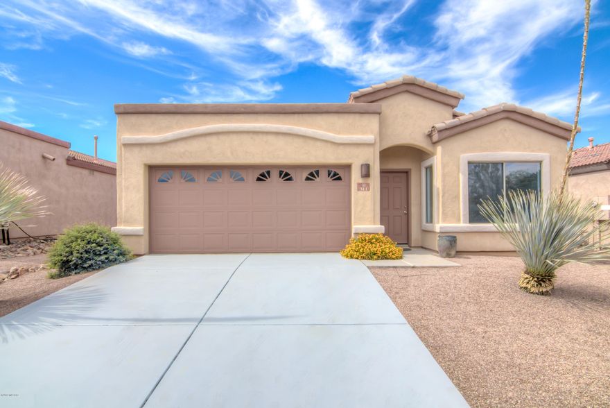 MOVE-IN READY!! This lovely 4 bedroom, 2 bathroom home is in a gated community, and has curb appeal! Inside you have stained concrete floor in the formal living/dining area. Kitchen has brand new s/s appliances. New carpet, paint, and roof has been inspected! Master Suite has a walk-in closet, garden tub, and executive height counters with dual sinks. Low maintenance landscape with fruit trees. Community pool and park is within walking distance. Come get this one before its gone. Will not last long!