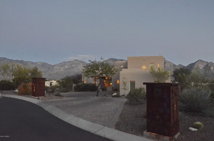 Fabulous, former developer/builder's own ridge top southwest contemporary. Home boasts full range Catalina Mountain views and wonderful city light views. Four bedrooms, three and a half baths. Wonderful diverse floor plan with many different options. Two family rooms downstairs, plus a terrific loft with many uses and fabulous views. Greatroom off the open kitchen with wood vigas and 14 foot wood ceilings. Huge windows bring the beautiful views and natural light into every room. Beautiful master suite with large sliding glass door to awesome balcony, amazing views, large master bath with over-sized walk-in shower and huge closet. Very private 1.86 ac lot, brick paver drive way, three zone A/C units, R40 Ceiling and R28 wall insulation with radiant heat barrier, dual pane, low E windows.