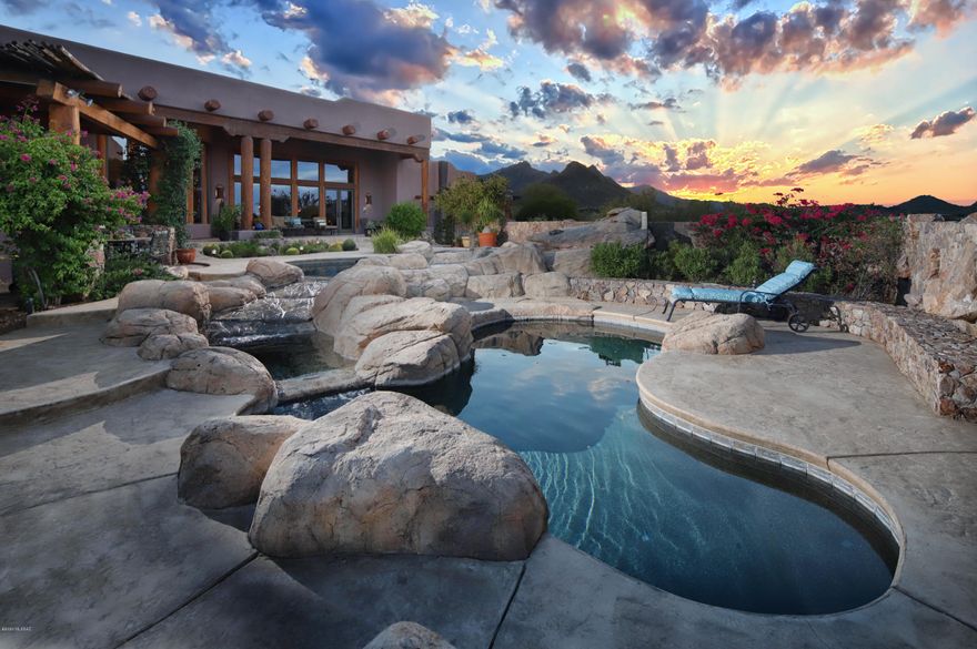 Arizona Lifestyle at its Best!!

Long driveway upward to this extremely private gated estate located in the Tucson Mountains bordering state land, The Saguaro National Monument. Secluded yet close to everything that Tucson has to offer, minutes to downtown, foothills and all the best shopping and restaurants. Walk out your front door and you are in a hiking, biking, wonderland of outdoor activities. 
Thoughtfully, the main house was designed to have the everyday living space on the entry level. Master suite, den/office, living room, gourmet kitchen and guest room to capture the panoramic views of the Santa Catalina Mountains, Tucson Mountains and Tucson city lights.
Gourmet granite kitchen with stainless steel appliances, 48inch Décor range, subzero refrigerator. bar seating, dining area, overlooking fabulous views.
Lower level, hosting a remarkable bar in a large room with endless possibilities with a door leading to outside pool area as well. Additional, separate large room on that level with bath that could be used as guest quarters, spacious exercise room, and or home theater. 
Separate guest house with 1100 sq. ft.., Kitchen, living room, fireplace, bedroom and covered patio. Also, with unsurpassable views!
Resort style backyard, pool, spa water feature, many outdoor sitting areas, covered patios and built-in barbecue.  Great for entertaining or just quiet nights to enjoy our Arizona sunsets, mountain and city views!
Oversized 3 car garage with plenty of storage!