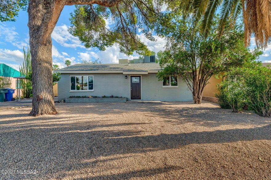 Wonderful Opportunity to Own Two Homes in Central Tucson for the Price of One! 2Bed/1Ba Main Home w/ 1Bd/1Ba Guesthouse. The Main Home Features a Welcoming Living Room & Cozy Family Room w/ Wood Burning Fireplace & Large Laundry Room. The Welcoming Kitchen has All New Cabinetry, Black Appliances w/ Gas Grill & Granite Countertops. Two Spacious Bedrooms & Beautifully Remodeled Bathroom w/ Custom Tiled Shower & New Vanity. The Guesthouse Has an Open Floorplan w/ Dining/Living Space & Lovely Kitchen w/ New Cabinetry, Black Appliances & Granite Countertops. Large Primary Suite & Remodeled Bathroom w/ Custom Tiled Shower & New Vanity. New Wood Look Flooring, Fresh Interior/Exterior Paint & Fresh Landscaping. Conveniently Located Near Shopping, Dining & Entertainment. Go Show Today!