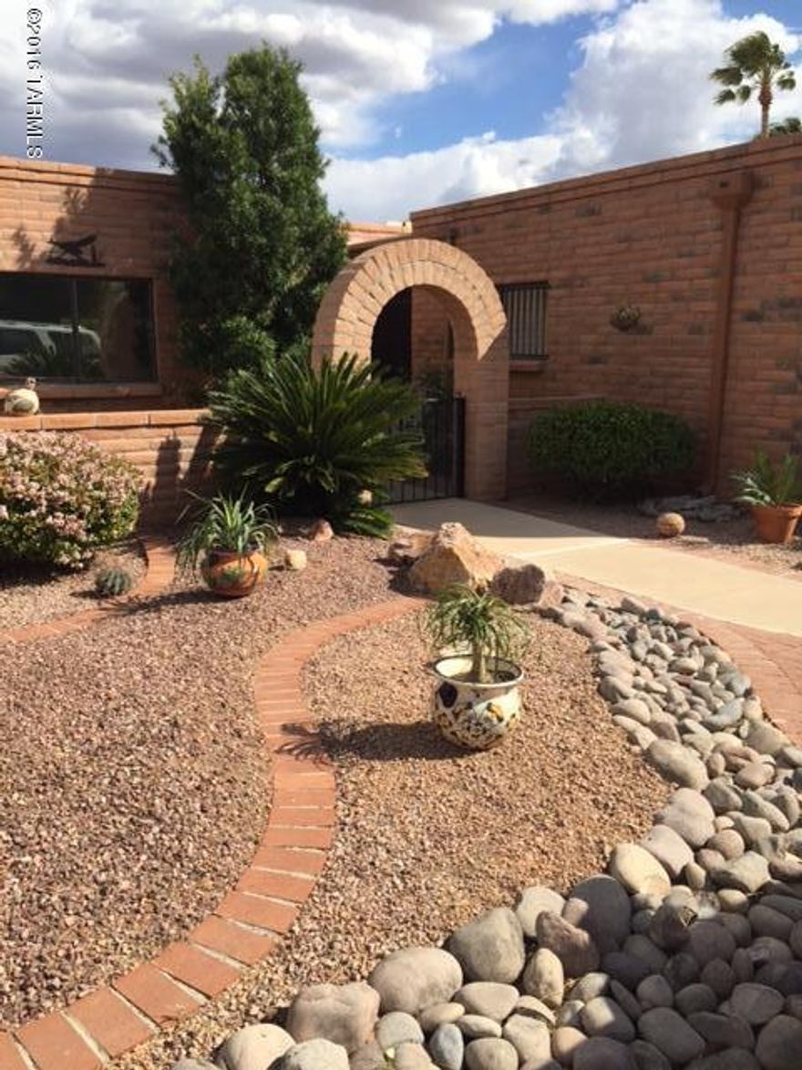 Mrs Clean lives here, no need to preview this beautiful Fairfield Townhouse. Enter thru the gated archway and enjoy the courtyard on your way to the secured entryway. The door opens to a light and bright home with a white kitchen and all new SS Appliances w/ washed satillo tile floors. Extra room could be den, office, exercise or hobby room. Beautiful gas Fireplace in Great room-- mtn views. Access to the covered  wrap around patio is from Great room, Den,or MBR. Open and Airy..
2 lg bdrms, 2 bath,x-lg Garage WITH lots of STORAGE & WORK SPACE PLUS A  UTILITY sink.  Plantation shutters, skylights and so much more. This is a must see for those looking for something really special and charming. 
The garden area is very nice with beautiful plants and Lemon  tree. Irrg. system for easy care.