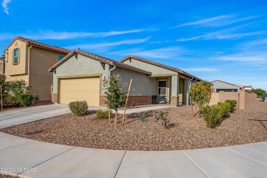 2.75% interest rate assumable mortgage available for your 2021- built Meritage Meadow model home. The heart of the home is a large, open great room and an upscale kitchen with a huge island and granite countertops. A flex room can operate as a home office, bonus room, or be walled off for a fourth bedroom - as the room already has a closet. The primary suite location provides ultimate quiet and privacy and boasts a large walk-in closet. The backyard faces north with lots of room - an extra wide corner lot just steps from a community pool, grassy fields, and playground. Ceiling fans, custom paint and more highlight your new home - move in and enjoy! Located in the highly desirable La Estancia community where you will love the great selection of schools available within the sought-after Vail School District. La Estancia has direct access to 'The Loop', an interconnected system of more than 120 miles of paved pathways and bike lanes, as well as a community pool, basketball court and seven beautiful parks. La Estancia is within close proximity to many major employers, including Davis-Monthan AFB, Tucson International Airport, UA Tech Park, Raytheon and Amazon. Come tour your gorgeous new home today!