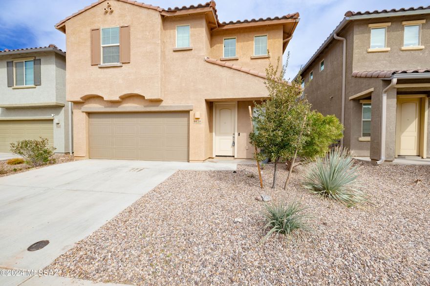 Home built in 2021 and located in the Vail School District. Assumable VA loan at 2.99%. Upgrade from standard builder paint and choose your own interior paint as seller is offering a $3500 paint credit. Split plan with primary bedroom downstairs and 3 oversized bedrooms upstairs with walk in closets. Smart home with Kevo door lock and MyQ garage control.  Dual control climate zone HVAC with smart thermostats. Close proximity to community pool and park. Turf and flagstone landscaping in the backyard! Home has a Taexx pest control system.