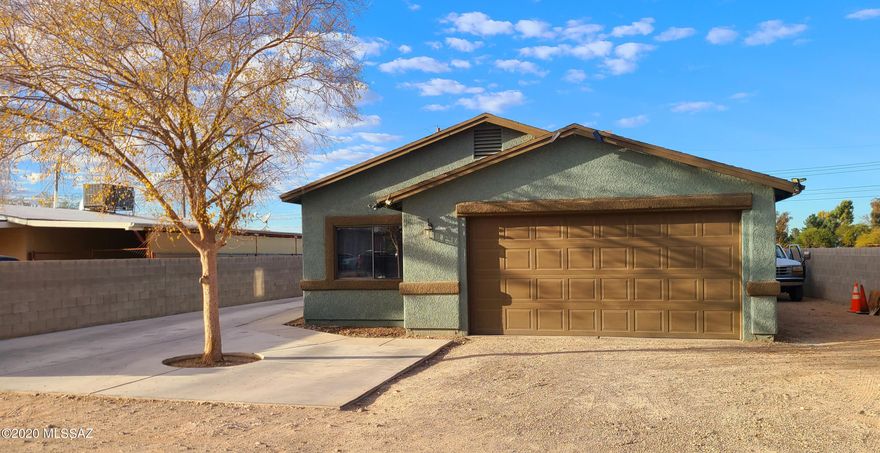 This lovely home was built on 2001 and offers 4 bedrooms, 2 baths, a spacious living room with separate dining area. The kitchen offers stainless steel appliances and granite countertops. Flooring throughout the house. 2 Car garage with lots of parking on both sides of home. Newer roof and A/C. Remodeled master shower. Fresh exterior paint. Large backyard W/ covered patio, storage bldg. and a view to the Rodeo Park. Security cameras and masonry wall fencing for privacy.  Solar system installed with low monthly payments.