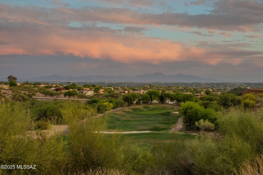 Perched in La Paloma's exclusive Ridge 4, this stunning home captures jaw-dropping views of the Catalina and Rincon Mountains, golf course fairways, and sparkling city lights—some of the best in the community. Inside, a chef's kitchen stuns with a Sub-Zero fridge, new Bosch dishwasher, Thermador gas range, and rich natural light. Travertine floors flow throughout, leading into a bright, open living area with a cozy gas fireplace and three sliding glass doors framing the unbeatable scenery. Located in the award-winning Catalina Foothills School District and minutes from upscale shopping and dining at La Encantada, the Westin La Paloma Resort, Sabino Canyon, and premier golf, this home blends elite comfort with an unbeatable lifestyle in one of Tucson's most sought-after gated communities.