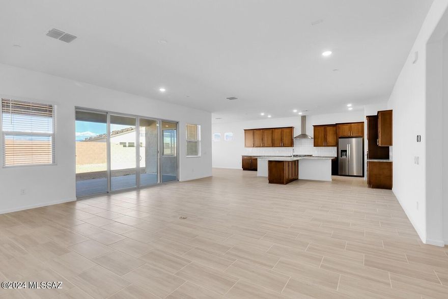 Gorgeous Mint plan with Desert Modern elevation. This exquisite home showcases 4 generously-sized bedrooms & 3.5 stylish baths. Coffered ceiling at foyer adds elegance & charm. Upgraded gourmet kitchen is a true masterpiece, featuring Refrigerator, 36'' gas cooktop & beautiful granite countertops. The open floor plan is perfect for entertaining, with a 12' centered sliding glass door that leads to a private backyard. Teen room provides additional space for relaxation or recreation. Laundry area includes Washer/Dryer, cabinet w sink. 4-car tandem garage is complete with Epoxy coating. Located on a cul-de-sac, this home is designed to meet all your needs.