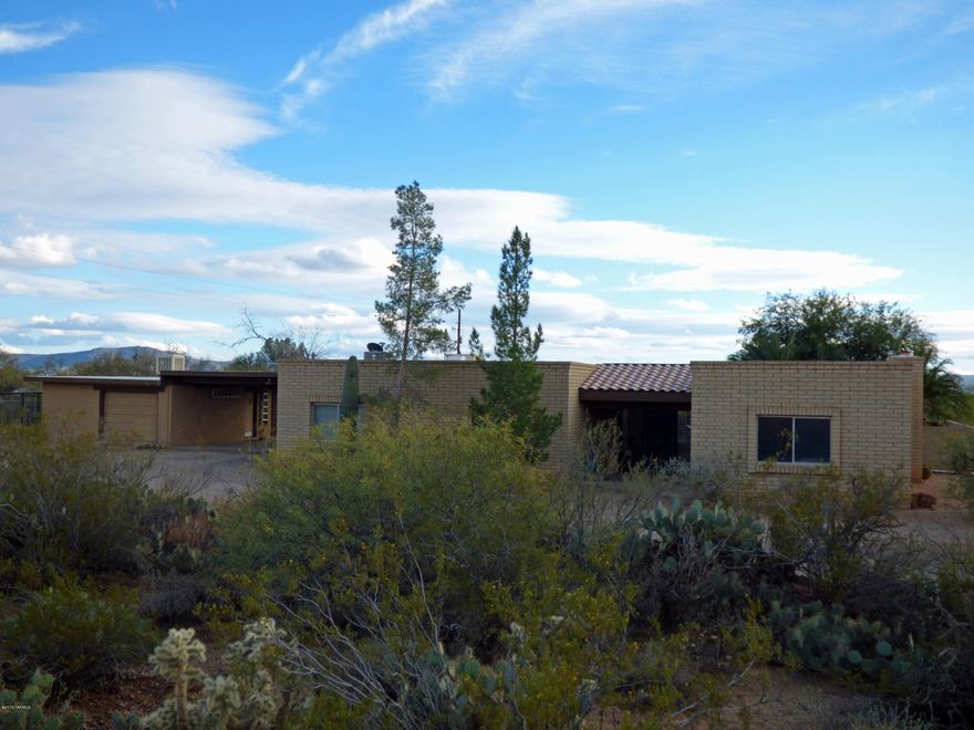Amazing property positioned on over 2+ acres with beautiful SW views and home featuring beautiful kitchen and bath upgrades and an open split floor plan. Backyard features a spectacular pool and low maintenance pristine landscaped backyard with built in BBQ island perfect for entertaining and pool parties. 2 car carport with an additional 3 car covered workshop, mechanics pit and secure office/work area. Property also features a covered workshop and RV Hookups for 3 units. Property line extends to gate at south end of the property.
This property could be packaged with adjacent property listing  for sale MLS#21600778 if more land is desired.