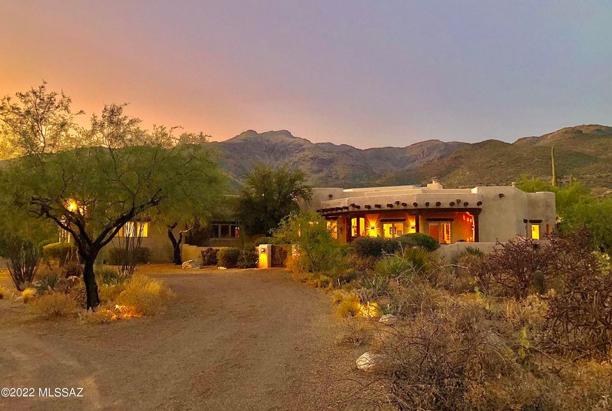Premier-quality Santa Fe style home at the base of Mt. Lemmon! Constructed by Tucson's award-winning builder Ray Birch, known for authentic one-of-a-kind dream homes with extreme attention to every detail. PLEASE SEE EXTRA DESCRIPTION UNDER DOCUMENTS!!! Unique custom features. Coved and ribbed ceilings, viga beams, Saguaro ribs, skip-peeled latillas, 4 kiva fireplaces, Saltillo tiles, Mexican tile accents in kitchen & bathrooms, Imperial plaster walls, custom cabinetry & vanities, jetted tub, walk in showers, gourmet kitchen, cozy breakfast area and dining room, exercise room, office, 3 car garage. Single level home on 3.34 acres horse property. Multiple private patios, 40'x14' heated lap pool, spa, outdoor kitchen, mature Saguaros and trees, low care desert plants. OWNED SOLAR PANELS! Near to fabulous cycling and hiking trails. Owned Solar System.
Please take a look for detailed description of this beautiful home in the Documents Section.


THE PROPERTY

Ø	3.34 acres horse property at the base of Mt. Lemmon
Ø	Breathtaking picturesque Catalina and Rincon Mountain views 
Ø	Designed and built in 2003 by award-winning builder and architect Ray Birch, famous for authentic high-quality Santa Fe style homes
Ø	Daily exquisite sunrise and sunset views
Ø	Natural desert vegetation including many mature Saguaros
Ø	Quiet and serene, despite being only minutes from city life
Ø	In the heart of Tanque Verde Valley with numerous fabulous cycling trails, great for birdwatching, hiking, and a healthy lifestyle 
Ø	Beautiful home for entertaining  can accommodate large social events
Ø	Upscale, quiet neighborhood
Ø	3-coated frame stucco
Ø	Hand troweled Imperial plaster walls
Ø	Oversized 3-car garage with built in storage cabinets 
Ø	Central vacuum etc.


THE HOME

Ø	Special attention to every detail
Ø	Inviting front yard with old Mesquite tree and cactus garden with water feature 
Ø	3,760 Square feet of living space
Ø	4 bedrooms and 5 bathrooms (3 full bathrooms, 2 half bathrooms)
Ø	Santa Fe style ceiling treatments including exposed wood, Viga beams, skip peeled Latillas, Saguaro ribs 
Ø	Knotty Cedar solid wood cabinetry with Saguaro ribs accents
Ø	Solid wood doors throughout the entire house 
Ø	Exterior French doors
Ø	Saltillo tile flooring 
Ø	Great room with 14 feet high ceilings 
Ø	Each bathroom has its own unique theme created by Mexican Talavera sinks and exclusive inlayed Mexican tiles
Ø	3 gas Kiva fireplaces 
Ø	Large laundry room with many cabinets


IN THE KITCHEN

Ø	Gourmet/Chef's kitchen
Ø	Extensive counter space with gorgeous Mexican tile accents
Ø	Large center island 
Ø	Large walk-in pantry
Ø	Built-in desk
Ø	Formal dining area with built-in buffet and wet bar with Saguaro ribs cabinet doors


MASTER SUITE / MASTER BATH

Ø	Spectacular mountain views
Ø	Master bedroom with Kiva fireplace 
Ø	Jetted jacuzzi tub
Ø	Large walk-in shower with 3 shower heads
Ø	Separate vanities
Ø	Large walk-in closet
Ø	Mexican tiles and Saltillo tiles 
Ø	Vaulted ceilings (12 feet high)


BACKYARD 

Ø	Unobstructed gorgeous mountain views
Ø	Full length Saltillo tiled rear covered porch
Ø	Outdoor kitchen with BBQ 
Ø	Beautiful 40 x 14 feet lap pool with large sunbathing and seating area 
Ø	Wood burning beehive fireplace 
Ø	Elevated spa
Ø	Completely landscaped with low care desert plants and cacti
Ø	Old Grapefruit tree in the Western corner


SOUND / MUSIC SYSTEM

Ø	The house is wired for sound so that from a CD player or other music source, can be directed to each of the front bedrooms, the great room, the kitchen, and to the outside patio. Each room has a control for volume. 

EXTRAS 

Ø	Workout room / gym 
Ø	Large office room or family room or billiard room
Ø	OWNED SOLAR PANELS