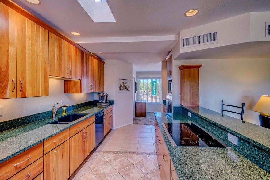This meticulously maintained, lovingly updated 3BR, 2BA territorial home sits on elevated lot in highly desirable Casas Adobes, featuring majestic mountain views against a saguaro studded landscape. Indoor/outdoor entertaining spaces with covered patio leads to backyard, starring a STUNNING fully fenced, newly renovated pool highlighted by a laguna/shamu shelf. Enjoy Catalina Mountains views by day and star lit desert skies at night. Inside: Your inner celebrity chef will enjoy this immaculate kitchen furnished with quartz countertops, Medallion Designer cabinetry and stainless steel appliances. Master Bedroom Retreat offers both a newly created ensuite bathroom with designer shower and large walk-in closet. Backing up to Greenbelt area = PRIVACY.  NO HOA ***MORE DETAILS ATTACHED***