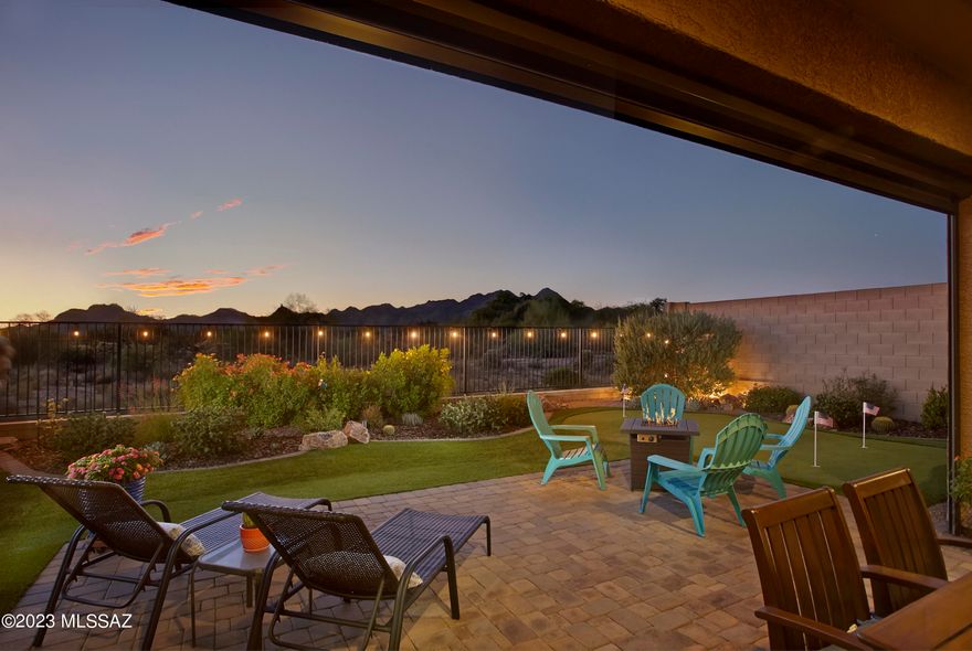 Bordering a nature preserve in Center Pointe at Vistoso, 13671 N Meadowhawk Lane offers a turn-key residence in a gated community with excellent amenities.  Built in 2017, this single-story residence includes 4 bedrooms (2 on either side of the home), 3 full baths, plus a dedicated office and separate bonus room. Prominent views of the Tortolita Mountains anchor the open concept great room and breakfast nook.  The chef's kitchen includes granite counters, double ovens, stainless appliances, a gas cooktop, extended cabinetry, reverse osmosis filtration, and a spacious pantry. Living space comfortably extends outdoors with a gated front courtyard and covered back patio that includes a new electric solar screen. Fully landscaped, including a putting green, the low maintenance backyard sits next to designated open space with exposure to both colorful sunsets and mountains.

Within the neighborhood, residents enjoy a variety of amenities for an active and social lifestyle. The community center includes a 25-meter pool, in-ground spa, splash pad, BBQ grill with seating, and a lounge area with a cozy fireplace. There is also a spacious indoor kitchenette for meetings or events. Beyond the community center, there is a playground, covered ramadas with picnic tables, walking paths and access to the 6.2-mile paved Vistoso Trail.

Within a short radius, there are multiple schools, parks and a plaza with a grocery store and shops. An excellent bike lane is immediately available, connecting to "The Loop" 135-mile paved multi-use path.  Oro Valley Hospital complex and medical plaza is within 10 minutes, as well as world-class hiking trails at Catalina State Park, 20+ miles of mountain biking trails at the Big Wash Trailhead, and the Oro Valley Marketplace with a variety of dining, retail & movement studios.
