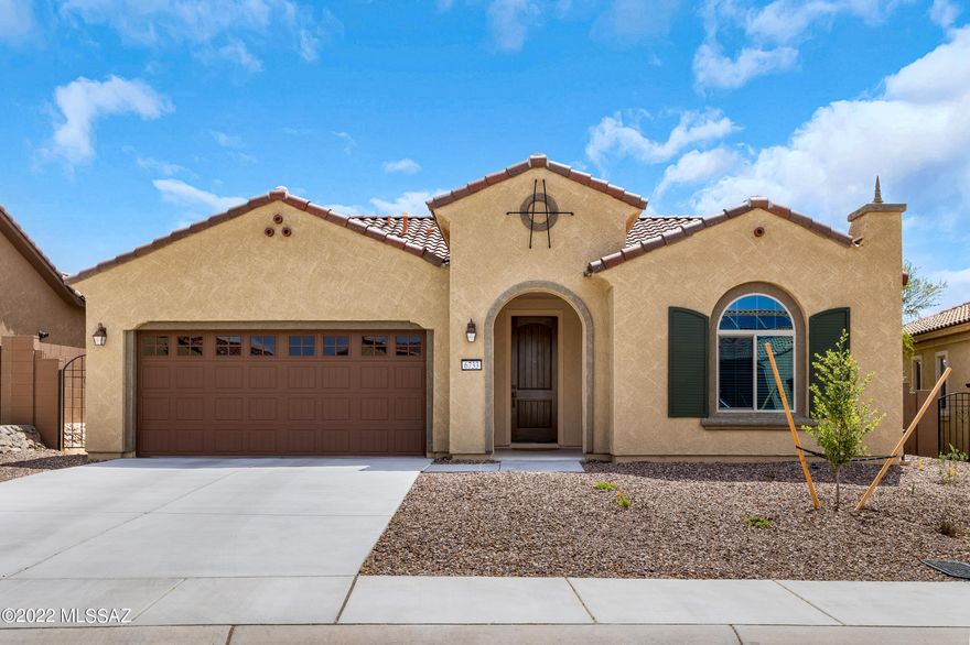 Del Webb Dove Mountain, an active adult community with social activities, and world class resort style amenities. Built in 2021, this beautiful Preserve model is 2 bedrooms, 2 baths plus den/office. Chef's kitchen with gas cooktop, granite counters, stainless appliances, great room floorplan, and dining area. Upgrades include 8 ft doors, second bath with shower, primary suite bay window with French door to patio, 2.5 car garage with golf cart parking, pre-plumbed for soft water loop and laundry sink. Enjoy the evenings on your patio with an outdoor fireplace. All appliances and washer, dryer convey. Why wait to build, this house is move in ready!