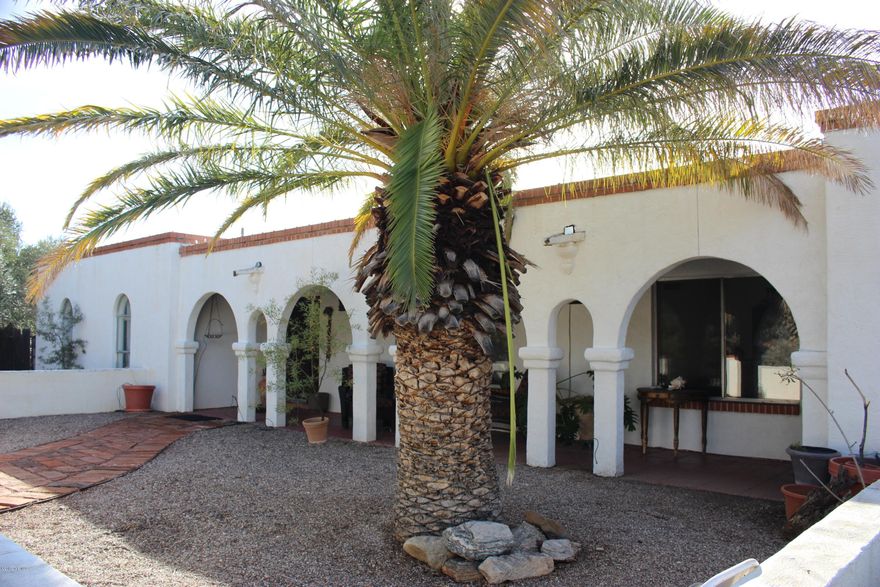 Truly special foothills home carries the charm of the Old Pueblo hacienda throughout. Concrete countertops in kitchen, lots of tile flooring, arches, many windows. Family room looks out to pool area with splendid city and mountain views. Private setting, over an acre lot, with lots of outdoor living options including front and back covered patios, decks and walking paths. Catalina Foothills Schools. Full RV hook up. Some TLC needed re: deferred maintenance. Motivated Seller! Foreclosure nearing. Net of $5000 to seller required. Call LA for more info.