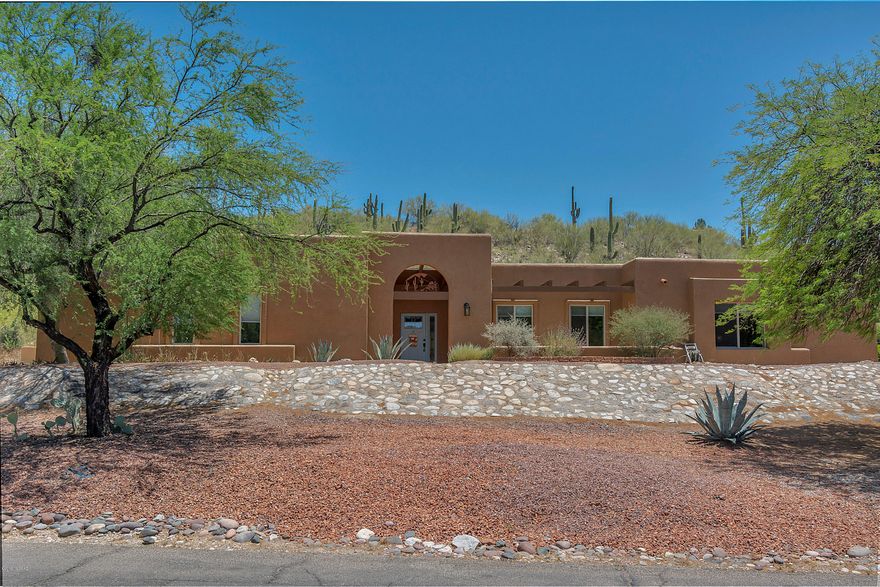 Beautiful foothills gem, meticulously maintained in a great location, & ready for your buyer. Large Mstr bedroom, big hall closet w/safe included, beautiful kitchen with island & ample hickory shelves, family room adjoining kitchen. There are Pergo floors throughout the home, formal dining room w/elegant chandelier, master bath w/walk-in shower, 2nd bath fully updated, large private patio great for entertaining with abundant desert vegetation, planters & drip irrigation, home has newer exterior paint, bedrooms have large closets w/shelves, step-down living room, no neighbors behind you, all doors redone and repainted. The garage has a large closet that could be a workshop. Washer & dryer included in the laundry room, ceiling fans throughout the house. Room dimensions available on  request.