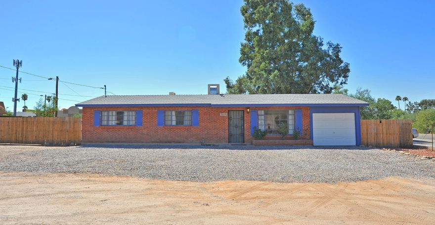 Very cute home in a spectacular location of town.  The home has been recently remodeled.  Tiled floors laid on a diagonal pattern. Kitchen has gorgeous Hickory cabinets, new stove, dishwasher and refrigerator. Large dining area off of the kitchen. 
3 bathrooms - one with a jacuzzi tub.  Freshly painted. No popcorn ceilings. 
All bedrooms have ceiling fans, laundry room with storage.  The den is located near the family room with colored concrete floors. Oversized extended patio opens to the huge rear fenced yard.  Double 12' gate and an additional 3' side gate. Storage shed. Security screen doors, lots of room for parking.