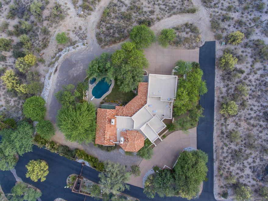 2xTAR Tour Winner ! Rare opportunity in gated Colonia del Sol, prime Foothills with easy commute UofA, Banner, walk to Hacienda del Sol.  Oriented to maximize mountain & city views to enjoy year round resort style living & entertaining. Sound wired in and out.  Quality masonry construction, cantera details and soaring ceilings.  Split plan. Two fireplaces. Polished, scored concrete floors, beamed ceilings.  Large covered wrap around patio with great flow.  Additional private patios shaded by mature trees.  Master has retractable awning.  Kitchen has gas cooktop on center island with ample seating and storage.  Bonus space for wine cellar or man cave ready for your inspiration.  Plus room for the ''toys''.  Cool canyons. Short drive to La Paloma Country Club for golf, fitness, dining. New windows, carpet and fresh paint.  Pool has pop ups and new equipment.  Exposed aggregate driveways.  One owner.  District 16 schools. 

This home with acreage loves to spoil the owner.  Cozy and private inside the masonry smooth stucco walls.  Room to roam outside.  Perfect for tree and nature lovers.  Amazing sunsets and lots of creatures to observe.  Come up and see for yourself !