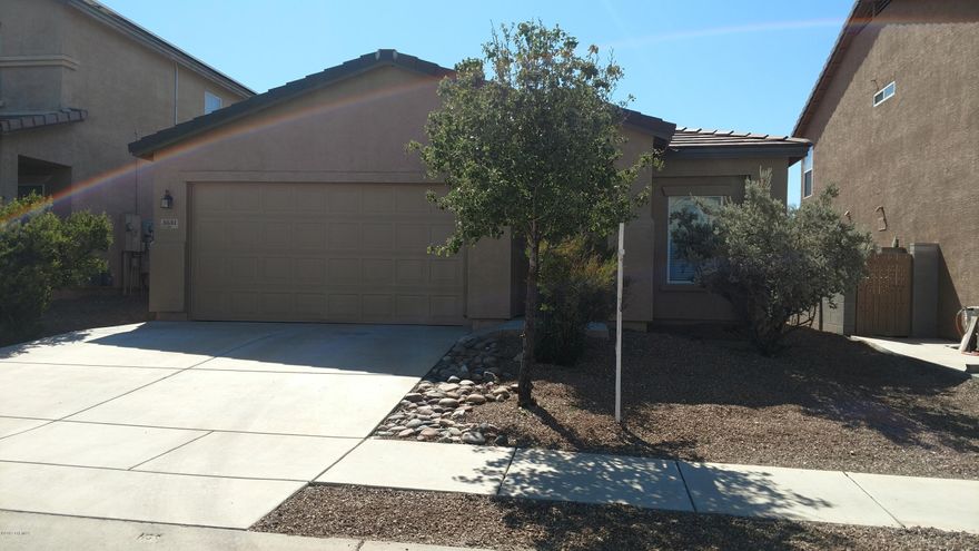 Recently updated four bedroom two bath home in desirable Northwest Tucsons Hartman Vista Community. Features a bright open floor plan to include newer carpet throughout with ceramic tiled in eat in kitchen and newly tiled showers. NEW dishwasher, stove/oven, doors, and window coverings, with custom paint inside and out. This home has gorgeous mountain views with privately walled back yard and no rear neighbors. Boasts a two car garage, front and back yard low care desert landscape with plenty of outdoor space.