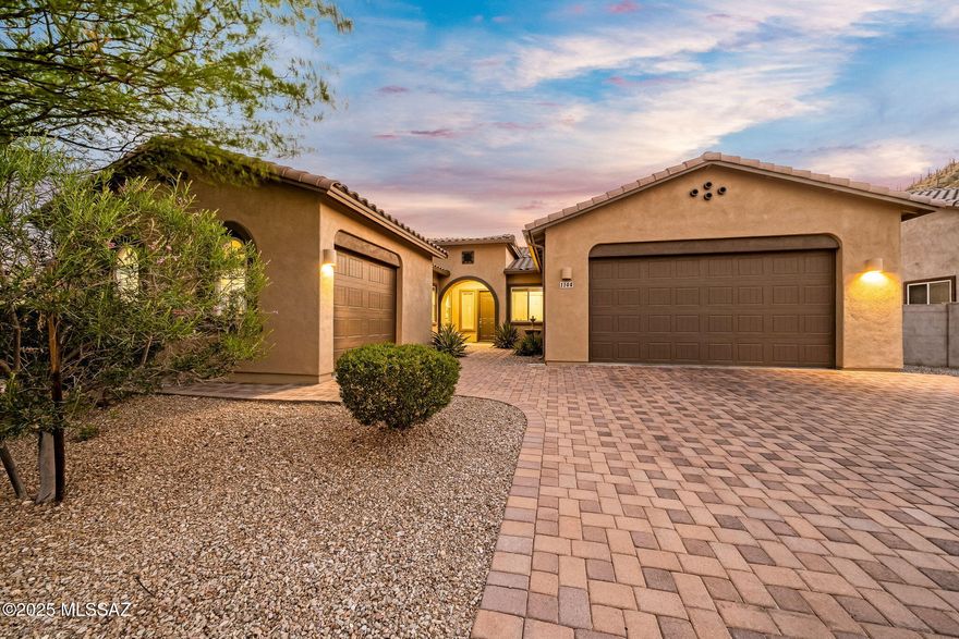 Tucked inside a gated community near Tucson's desirable Starr Pass, this beautifully maintained one-owner home is minutes from downtown, shopping, and freeway access. With 4 bedrooms, 3 bathrooms, and tasteful updates, it also features a bonus room ideal for an office, gym, or media space. The 3-car garage is split into a 2-car and 1-car bay, with the single bay featuring a mini-split AC—perfect for a workshop or home gym. Enjoy mountain views from the front and backyard, a sparkling pool, lush landscaping, paver driveway, and a retractable awning for shaded outdoor living. Lovingly cared for and move-in ready, this home offers comfort, flexibility, and location. Schedule your private tour today!
