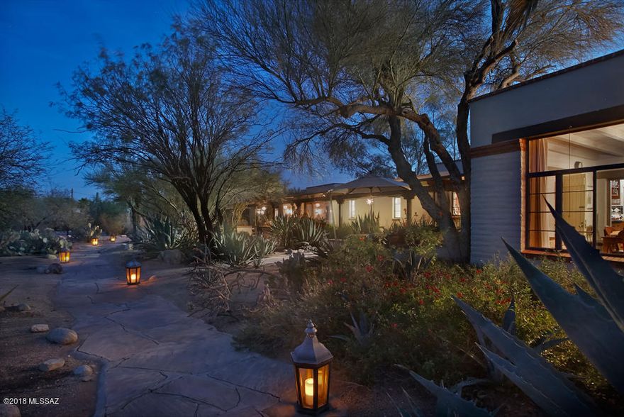 This gorgeous 1948 Joesler built Mud Adobe home w/separate 1022sf casita, is perfect for an artist, a sole practitioner, or RBO rental. Live in Sonoran Desert splendor on your own lush private 2.1 acre estate in a resort like setting within walking distance to historic Casas Adobes Shopping Center, amazing restaurants, fitness facilities & Whole Foods grocery. Enjoy the flora, fauna & mountain vistas from the extended front patio. The beautiful interior craftsmanship details are typical of a Joesler, w/every window capturing what makes the outdoors in Tucson special. Master suite has a spacious walk-in closet & a master bathroom w/extensive artistic glass & tile work. The kitchen is a home chef's delight w/SubZero fridge, professional stove & large walk-in pantry. Must see to experience!